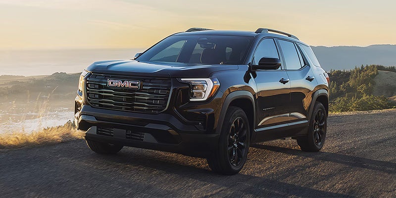 GMC Terrain SUV driving outdoors